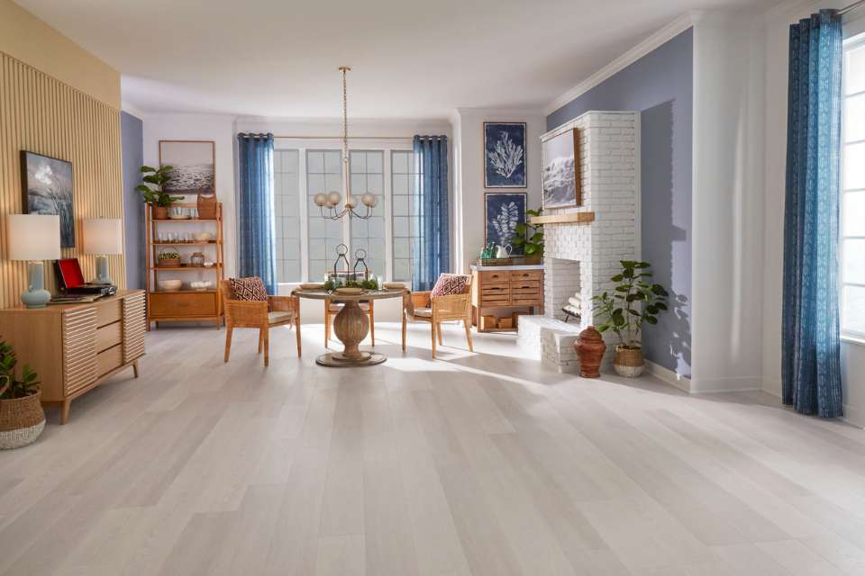 light grey oak look flooring in mid century modern living dining space